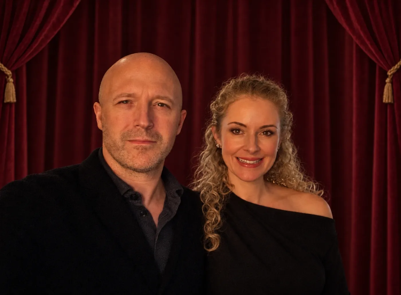 Cindy and Jérémie Pulinx in front of a burgundy theatre curtain
